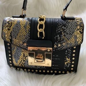 Snakeskin print and chain detailed handbag